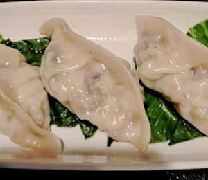 H02. Steam Vegetable Dumpling $10.00 Steamed dumplings filled with napa cabbage, carrots, and shiitake mushrooms