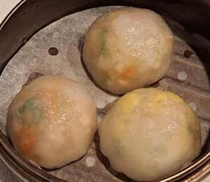 H09. Nourishing Dumpling $11.00 Steamed dumplings filled with Chinese yam, goji berries, corn, raisins, king mushrooms, Chinese water chestnuts, carrots, scallion, and cilantro