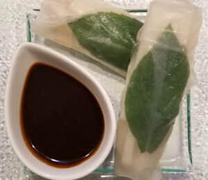 03. Summer Roll $8.00 2 Vietnamese-style rice paper rolls filled with basil leaves, bean curd, carrots, cilantro, and jicama with hoisin sauce on the side