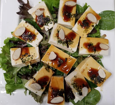 05. Cold Silken Tofu $7.00 Cold silken tofu topped with soy sauce, sesame oil, sesame seeds, sliced almonds, and dried seaweed