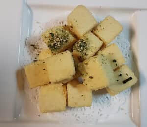 04. Agedashi Tofu $8.00 Deep-fried Japanese-style tofu topped with dried seaweed and sesame seeds