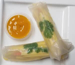02. Mango Roll $9.00 2 rice paper rolls filled with cilantro, avocado, carrots, jicama, bean curd, and shredded mango with a mango-mustard sauce on the side
