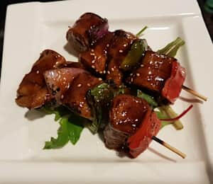 15. Seitan Skewer with Teriyaki Sauce $10.00 Grilled seitan, onion, and bell pepper skewers with teriyaki sauce