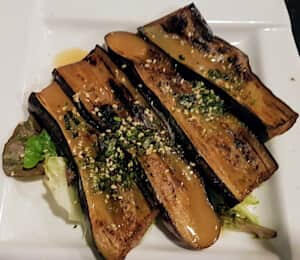 07. Baked Eggplant with Miso Sauce $8.00 Baked eggplant with miso sauce, topped with dried seaweed and sesame seeds