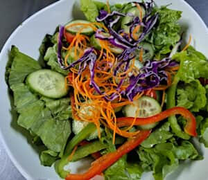 08. Green Salad $10.00 It comes with a vegan Thousand Island or carrot-ginger dressing.