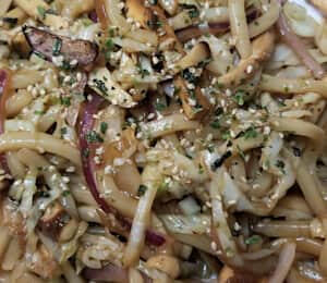 07. Yaki Udon $18.00 Japanese-style stir-fried udon noodles with shredded cabbage, dry tofu, shiitake mushrooms, onions, and carrots