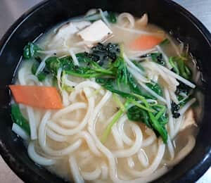 02. Udon Noodle Soup $14.00 Thick Japanese udon noodles, tofu, seaweed, spinach, carrots, and mushrooms in miso soup