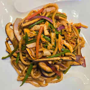 Kimchi Yaki Udon $20.00 Stir fried udon noodles with shiitake mushrooms, onion, bell peppers, dry tofu, snow peas, and vegan kimchi