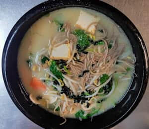 03. Soba Noodle Soup $16.00 Thin buckwheat soba noodles, firm tofu, seaweed, spinach, carrots, and mushrooms in miso soup