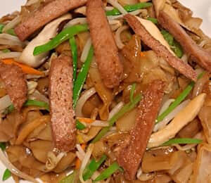 • Chow Fun - Vegan Beef $19.00 Stir-fried flat rice noodles with vegan beef (seitan), onions, snow peas, bean sprouts, and carrots