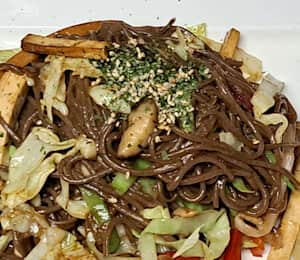 08. Yaki Soba $16.00 Japanese-style stir-fried soba noodles with cabbage, dry tofu, bell peppers, shiitake mushrooms, carrots, and onions
