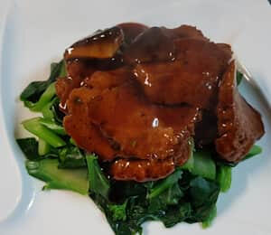 D14. Black Pepper Vegan Beef $20.00 Sautéed slices of tender seitan in a savory black pepper sauce on a bed of spinach