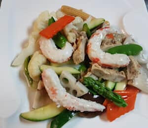 D12. Vegan Seafood $22.00 Sautéed vegan seafood with asparagus, broccoli, snow peas, carrots, zucchini, sliced lotus root, and baby corn