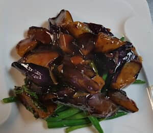 D04. Eggplant String Bean (Spicy) $17.00 Sautéed eggplant in basil and garlic sauce on a bed of string beans