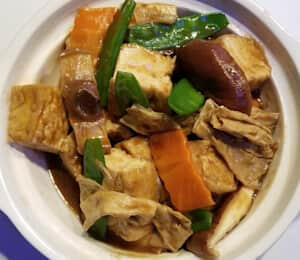 D23. Home-Style Braised Tofu $19.00 Fried tofu, shiitake mushrooms, carrots, snow peas, and bean curd skin braised in a homemade brown gravy sauce